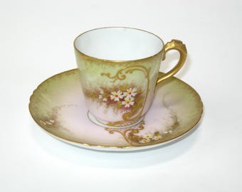 Juego de taza y platillo de porcelana de Limoges Charles Field Haviland, con relieve dorado y nomeolvides blancos sobre fondo rosa y verde, Francia antigua de 1890