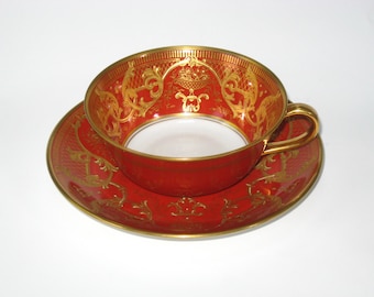 Taza y platillo de porcelana Bernardaud de Limoges, color rojo sangre de buey con incrustaciones de oro, decorados en una fábrica antigua, Francia