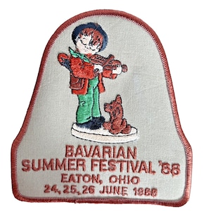 May include: A white ceramic mug with a black handle and the text "But First, Coffee" in a black, handwritten-style font. The mug is on a white surface.