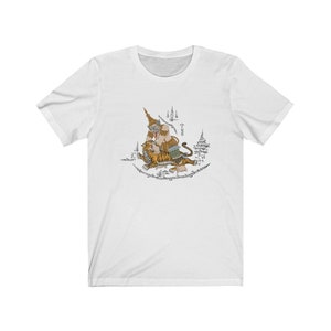 May include: White t-shirt featuring a graphic of a mythical creature with a tiger. The creature is depicted in a traditional Thai style with intricate details and surrounded by text in Thai.