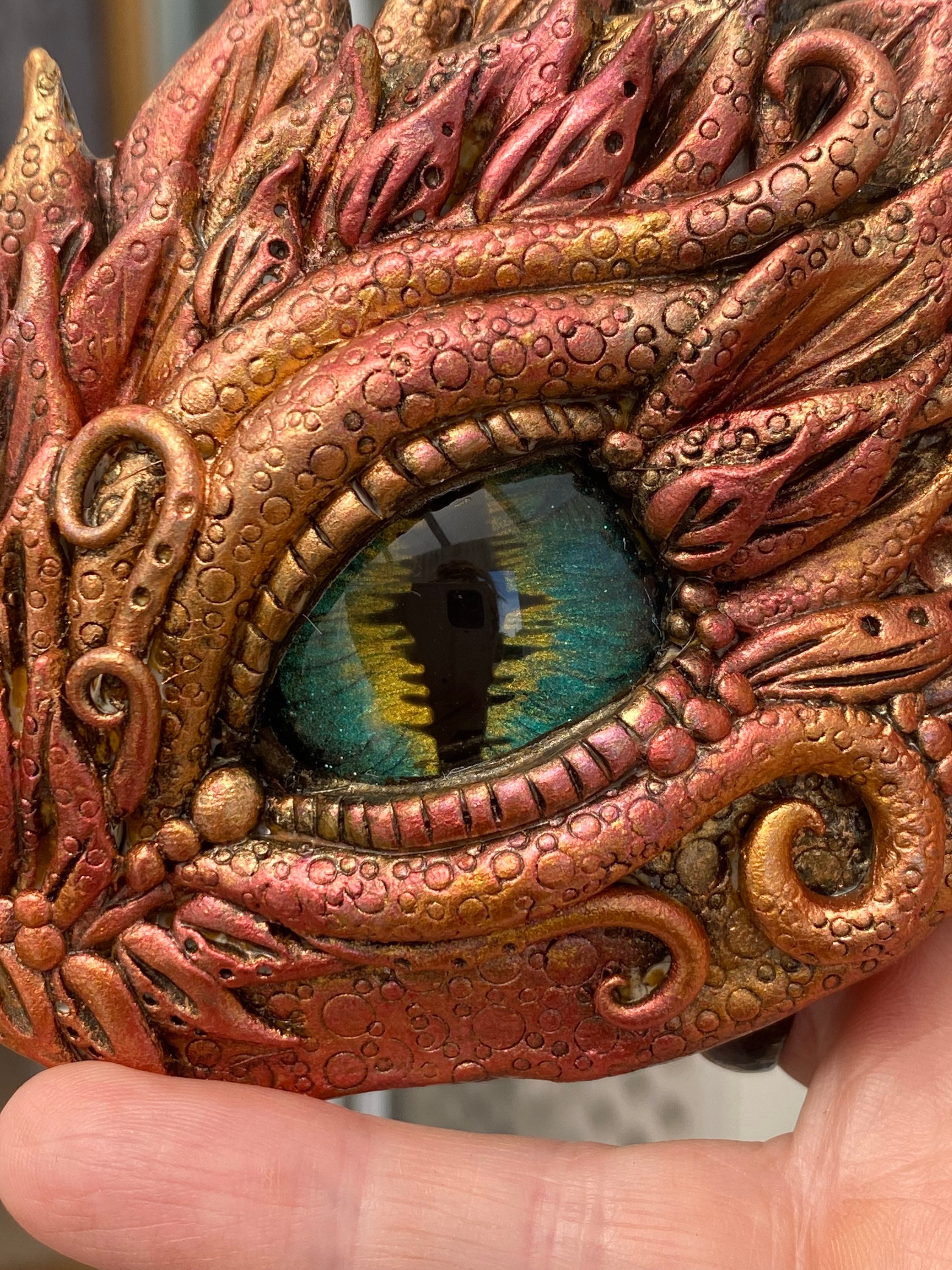 Artist Crafts Fantasy-Inspired Accessories Featuring Realistic Dragon Eyes