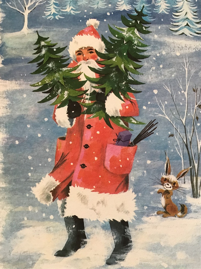 May include: A red-suited figure with a white beard carries a stack of Christmas trees through a snowy landscape. A small brown rabbit watches from the side.