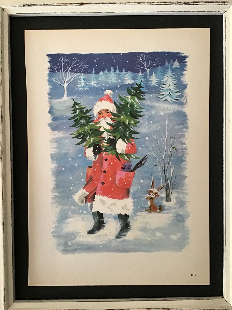May include: A vintage Christmas card illustration of Father Christmas carrying a Christmas tree in a snowy forest. A small rabbit stands to the right of Father Christmas. The card is numbered 107.