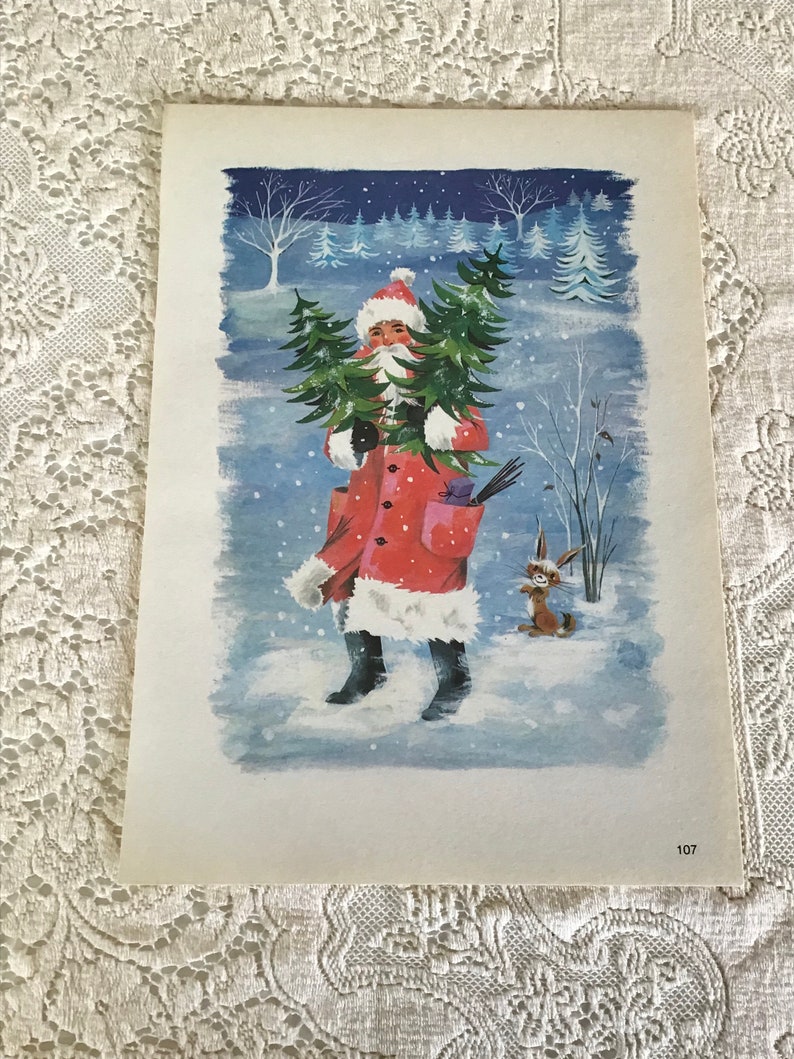 May include: A vintage Christmas card depicting a red-suited Father Christmas carrying a small Christmas tree in a snowy winter scene. A small rabbit stands to the right of Father Christmas.