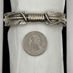 Beautiful Handmade Navajo Feather Braclet.  Handmade large Cuff Sterling Silver and signed