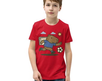 Camiseta divertida con gráfico de carpincho jugando al fútbol: adorable carpincho jugando al fútbol para amantes de los animales, los deportes y los niños.