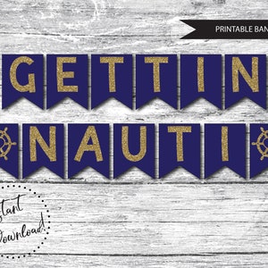 May include: A navy blue and gold glitter banner that reads "Gettin Nauti" with a gold glitter nautical wheel on each end.