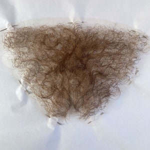 Peluca púbica de cabello humano de color castaño claro/rubio de encaje fino de calidad profesional/peluca púbica de Merkin Postiche para cine/teatro/televisión