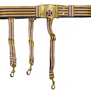 May include: A gold and purple striped belt with a gold buckle featuring a cross and the text "Fire Department" in a banner. The belt has three gold-coloured straps with hooks.