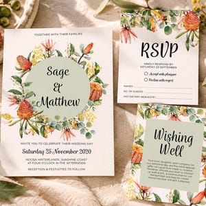 May include: A wedding invitation set featuring a main card, an RSVP card, and a wishing well card. Each white card displays watercolor illustrations of orange banksia flowers and green eucalyptus leaves with sage green circular accents.