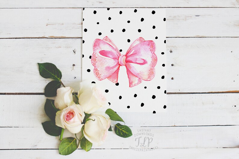 May include: A pink watercolor bow with a white background and black polka dots. The image includes the text "Instant Downloads TLP TheLittlePrintShop".