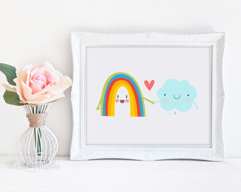 May include: A white frame with a colorful rainbow and a blue cloud with a red heart between them. The rainbow and cloud have happy faces and are holding hands.