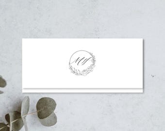 May include: A rectangular white card featuring a centered black line art logo. The logo consists of the letters MS in a cursive script enclosed within a circular frame decorated with delicate botanical illustrations of leaves and small flowers.