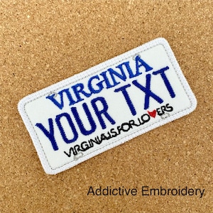 May include: White embroidered patch with blue text that reads "VIRGINIA YOUR TXT VIRGINIA IS FOR LOVERS" with a red heart.