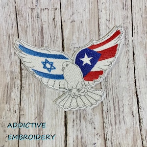 May include: An embroidered patch depicting a white dove with wings formed from the Israeli and Puerto Rican flags. The dove is in flight with its wings outstretched. The text "Addictive Embroidery" is visible beneath the dove.