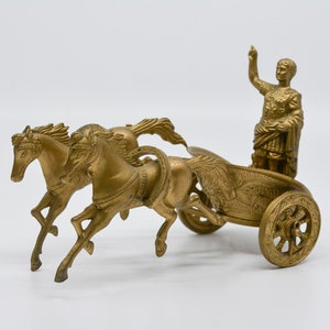 Vintage cast metal Ceasar riding painted metal, 7 inches wide, mid 20th century