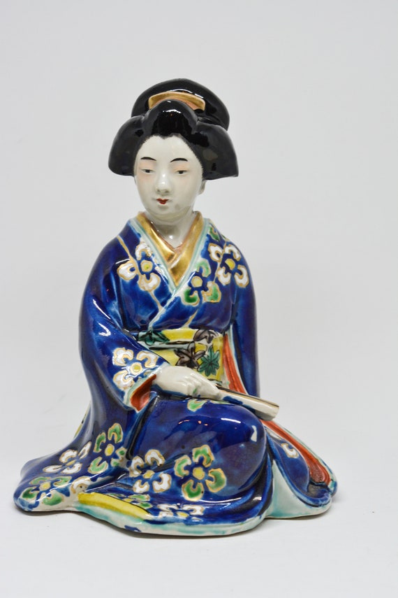porcelain geisha doll