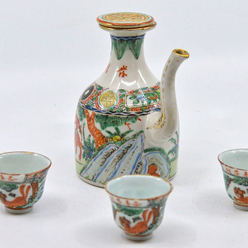 Antique, Chinese , porcelain tea pot and three shops small cups, 1940s