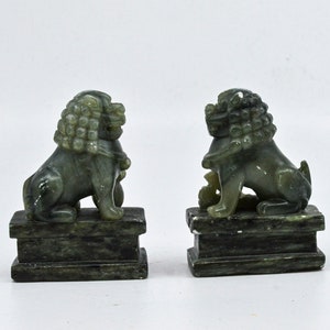 Vintage Chinese green , soap stone pair Fu lions, in display case, 3.5 inches tall. 1960s
