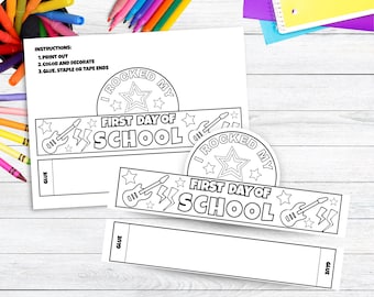 May include: Black and white printable paper crowns with the text "I Rocked My First Day of School". The design includes stars, lightning bolts, and guitars. Instructions are printed at the top.