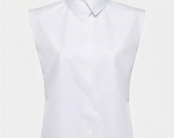 May include: A crisp white sleeveless blouse featuring a structured point collar and a concealed front button placket. The garment is tailored with clean lines, a straight hem, and a smooth finish, presenting a classic silhouette without sleeves.