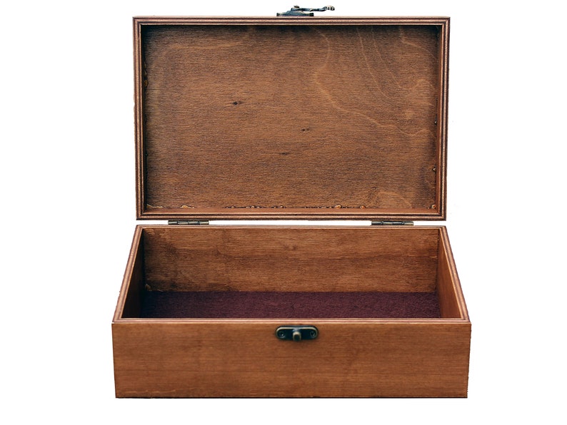 May include: An empty wooden box with a hinged lid and a metal clasp. The box is made of dark brown wood and has a brown felt lining.
