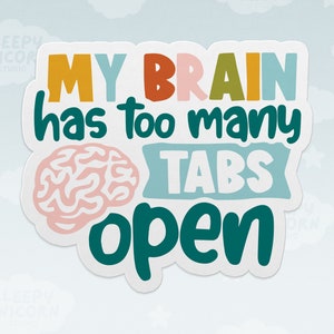 May include: A sticker featuring the phrase "MY BRAIN has too many TABS open" in multiple colours. A pink brain graphic is on the left. The sticker is white with a light blue background.