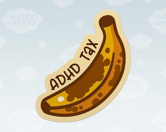 May include: A die-cut sticker shaped like a ripe, spotted yellow banana with brown ends. The text ADHD TAX is printed in a dark brown, rounded sans-serif font along the curve of the banana. The sticker has a light cream-colored border.