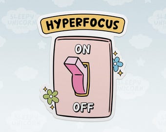 May include: A die-cut sticker featuring a light pink light switch plate with a pink toggle switch set to the ON position. The word HYPERFOCUS is printed in black on a yellow banner above the switch, with ON and OFF labels and small flowers.