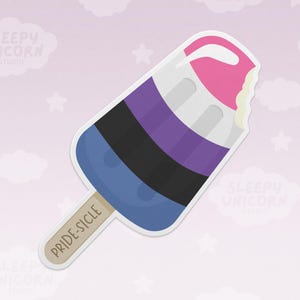 May include: A blue, black, purple, and white popsicle with a bite taken out of it. The popsicle is on a stick with the words "PRIDE-SICLE" written on it.