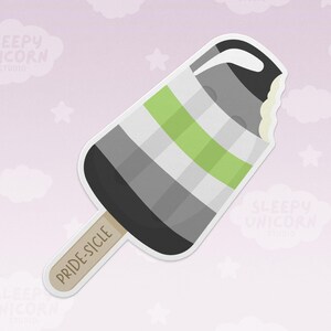 May include: A sticker of a popsicle with the colors of the aromantic pride flag: green, gray, white, and black. The popsicle has a bite taken out of it, and the stick reads "PRIDE-SICLE". The background is pink with white clouds and stars.