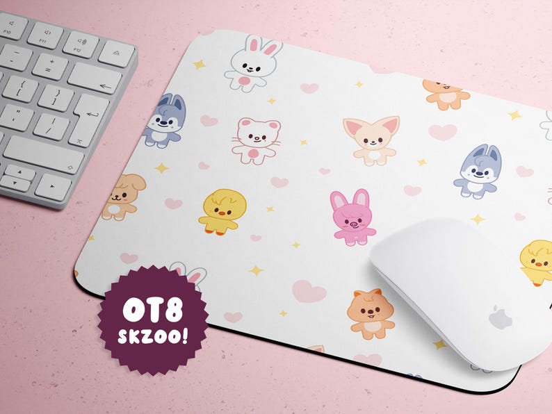 May include: White mousepad with cartoon animal characters, hearts, and stars. The mousepad has a white mouse and keyboard next to it. The mousepad has the text "OT8 SKZOO!" on a purple badge.