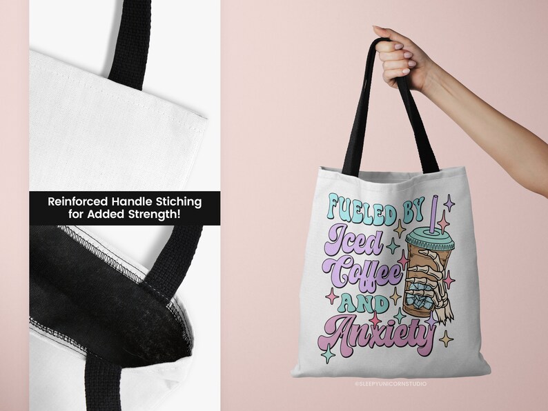 May include: White tote bag with black handles featuring the text "Fueled by Iced Coffee and Anxiety" in pastel colors. The design includes an iced coffee cup with a skeleton hand. Reinforced handle stitching is visible.