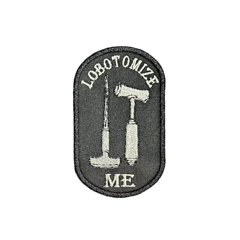 May include: Black embroidered patch with white stitching. The patch features two medical tools, a hammer and a chisel, with the text "lobotomize me" around the tools.