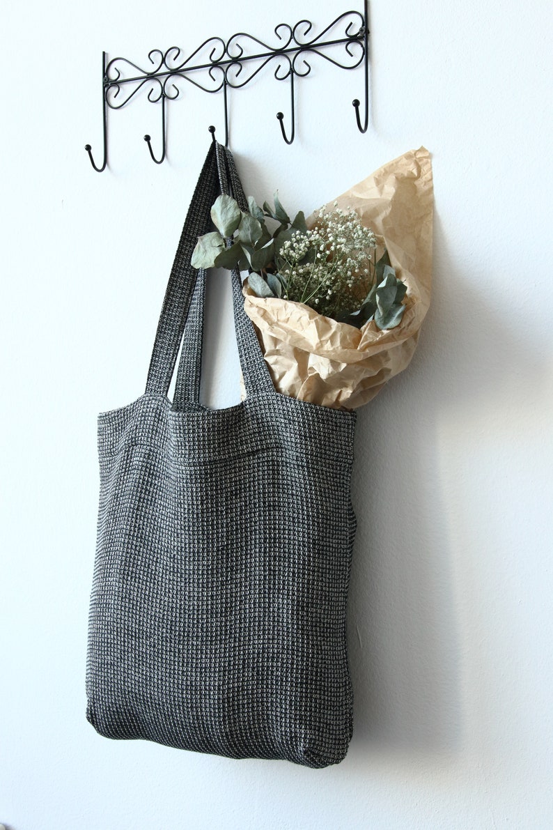 Black linen tote bag made of linen cotton waffle fabric with zippered pocket inside