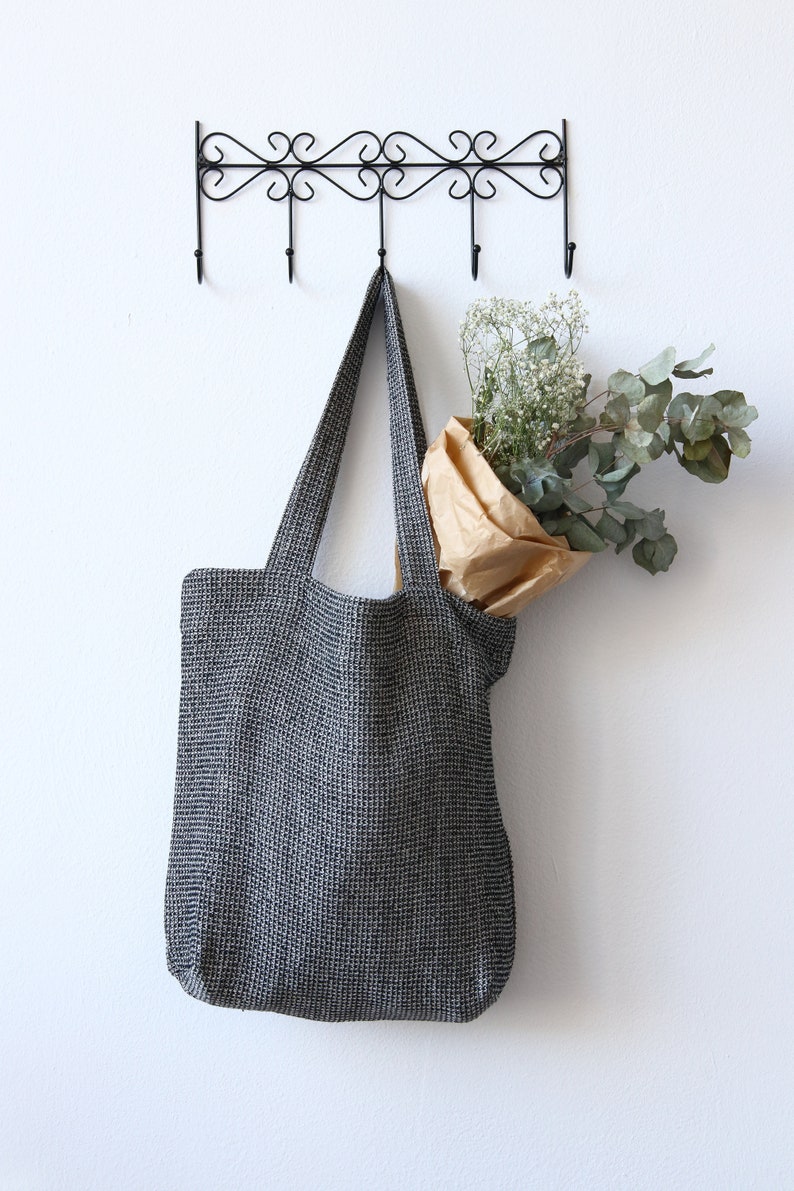 Black linen tote bag made of linen cotton waffle fabric with zippered pocket inside
