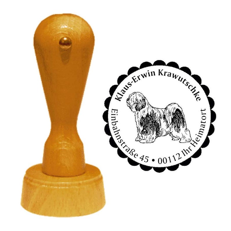 May include: A wooden stamp with a light brown handle and base, featuring a circular stamp design. The stamp design includes a detailed illustration of a dog and the text "Klaus-Erwin Krawutschke, Einbahnstra&szlig;e 45, 00112 Ihr Heimatort."