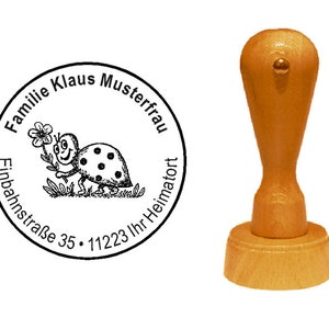 Francobolli coccinella di legno