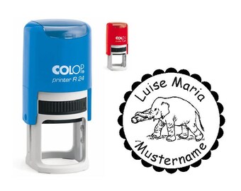 May include: Blue and white COLOP printer R 24 stamp with a red stamp in the background. A circular stamp with a scalloped edge features an elephant illustration and the text "Luise Maria Mustername."