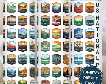 May include: White tumbler with a design of colorful US National Park logos. The tumbler has a straw included and the text "SHIPS NEXT DAY" is on the right side of the tumbler.
