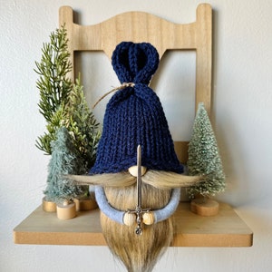Gnome holding a miniature sword, soft knit gnomes with faux fur beard and mustache