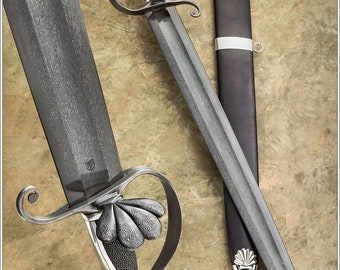 Wootz hunting sword with damascus and silver hilt and silver mounted scabbard