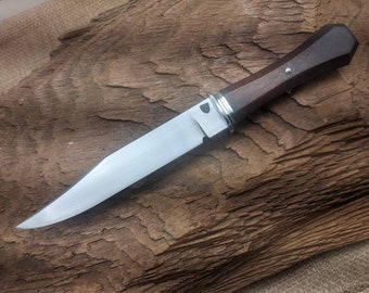 Bowie knife forged from 1084 steel with stained figured walnut handle nickel silver fittings.