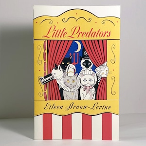 May include: A yellow, red, and white illustrated book cover with the title "Little Predators" and the author's name "Eileen Arrow-Levine". The cover features a group of cats dressed in costumes on a stage.