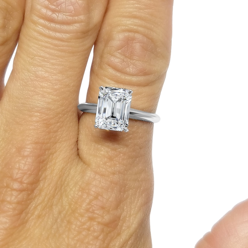 2 Ct Emerald Cut Solitier Moissanite Diamond Engagement Ring In 14k Yellow Gold 2 Ct Emerald Cut Solitier Moissanite Diamond Engagement Ring In 14k Yellow Gold