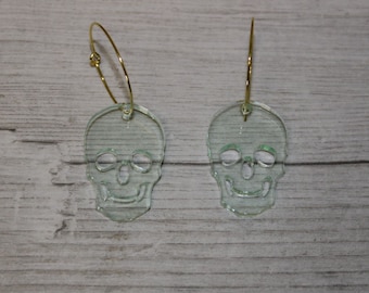 Skull earrings made from bottle green glass effect acrylic with choice of loop colours