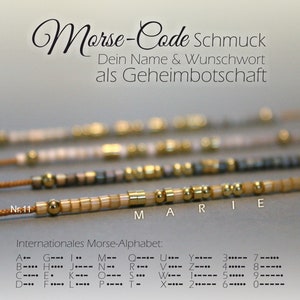 Puede incluir: Un primer plano de una pulsera de cuentas con cuentas doradas que deletrean la palabra "MARIE". La pulsera está sobre un fondo blanco con el texto "Morse-Code Schmuck" y "Internationales Morse-Alphabet" junto con el código Morse para cada letra y número.