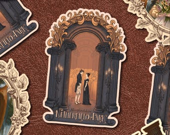 May include: A sticker featuring a romantic scene of a couple standing in front of an archway with pillars. The sticker has a cream border and the text "Hertfordshire Netherfield Park". The sticker is on a brown surface.