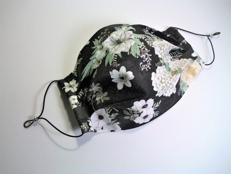 Pleated face mask with adjustable elastic ear loops and a