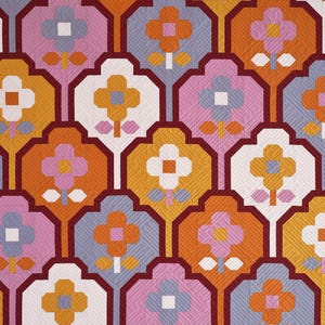 May include: A repeating pattern of stylized flowers in shades of orange, pink, white, and gray. The flowers are outlined in burgundy and have a quilted texture.